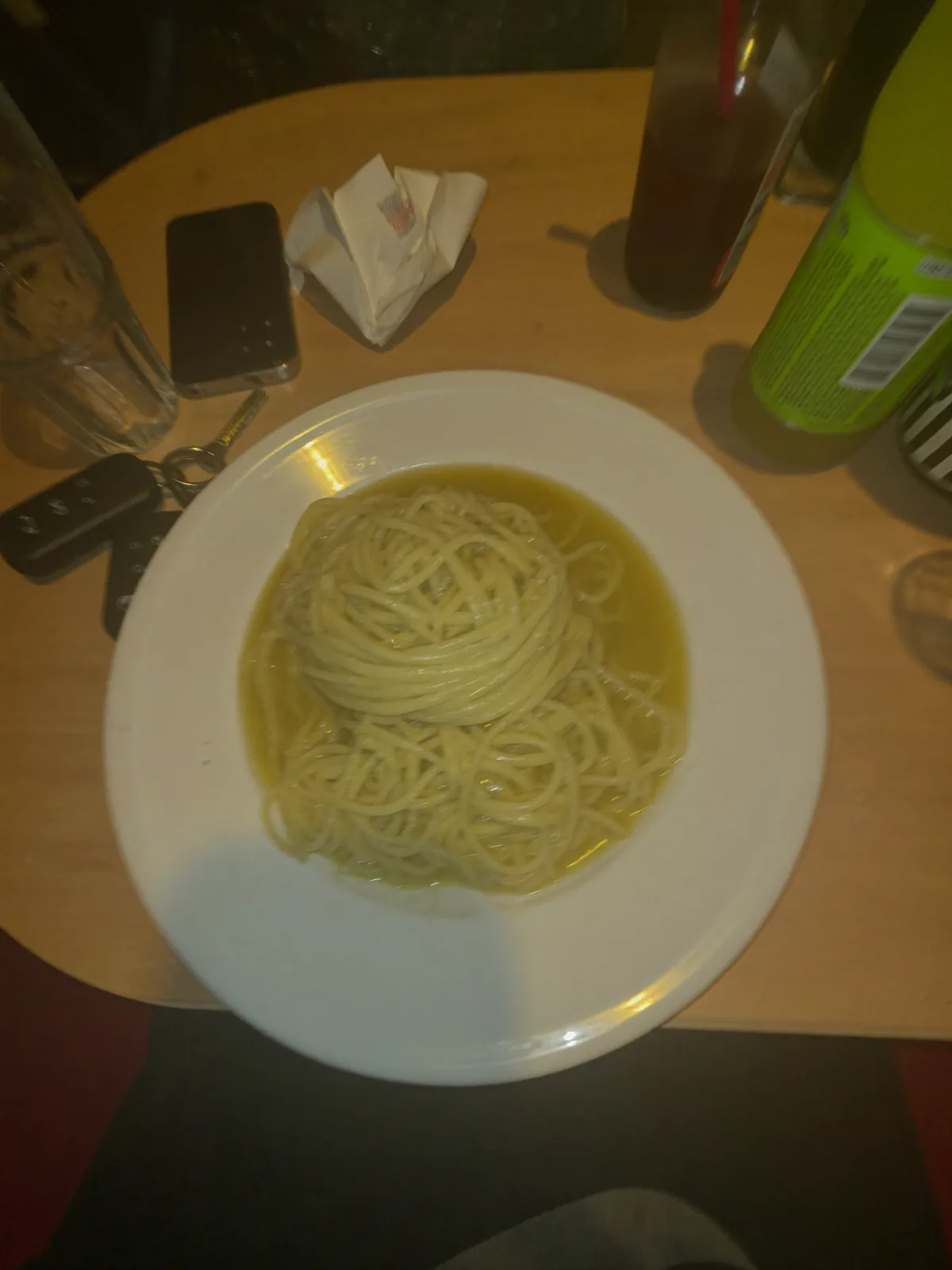Pasta shot from above on a phone under flat kitchen light